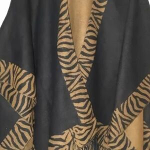 Accessory Street reversible black and light brown zebra print cape/poncho.